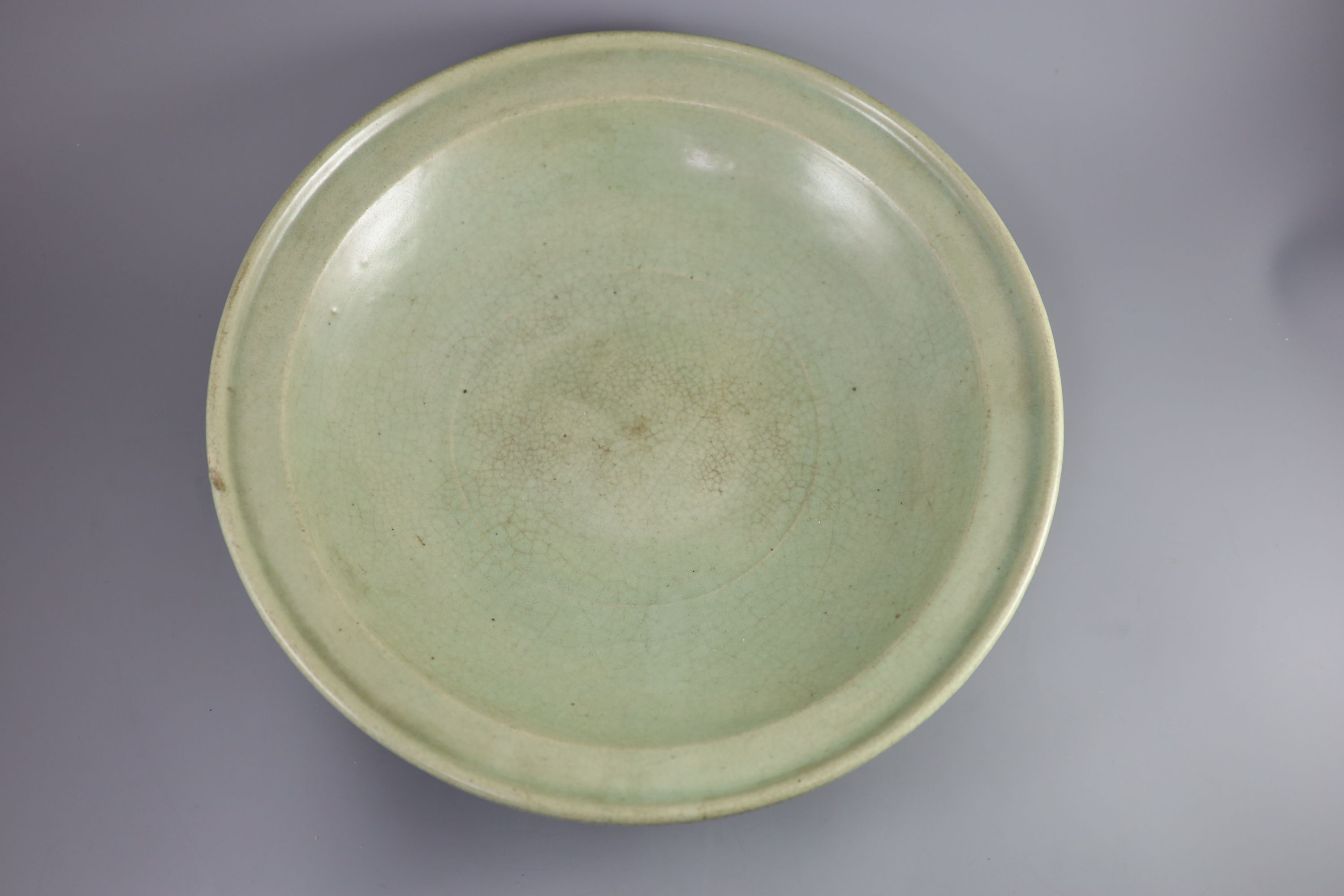 A Chinese Ming Longquan celadon dish, 15th/16th century, 43cm diameter